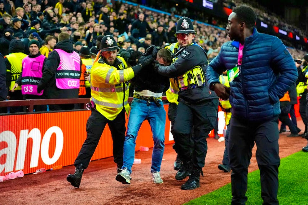 A YB chaot is taken away by the British police.