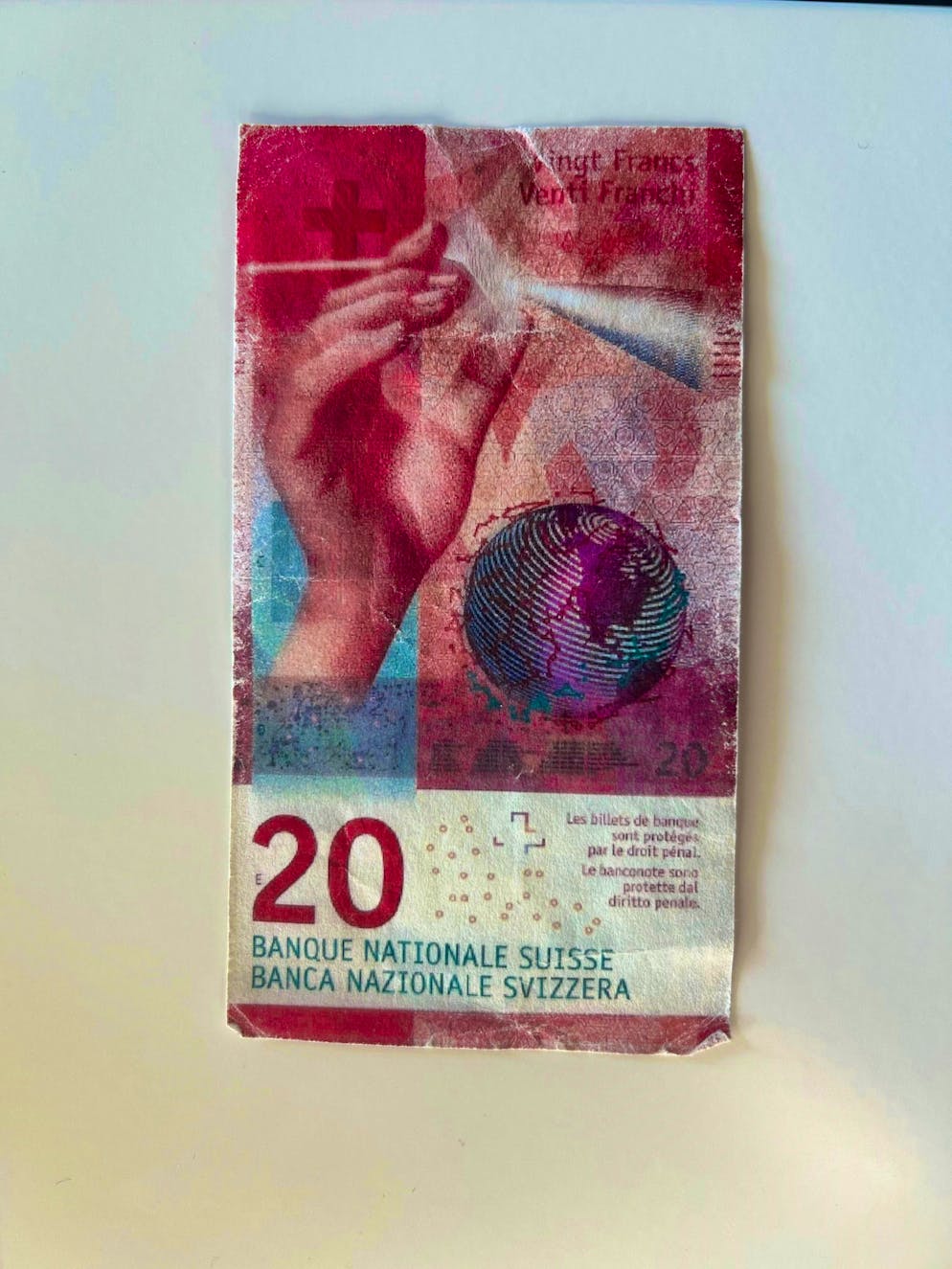 This is what forbidden counterfeit money looks like. This copied 20-franc note looks genuine from the front.