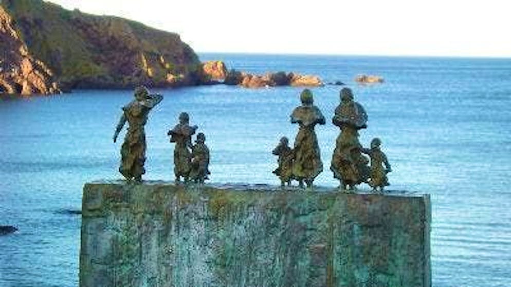 Women and children look out to sea and wait in vain for the fishermen: a memorial to the storm victims in the Scottish village of St Abbs.
