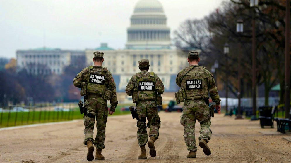 National Guard soldiers patrol Washington after the shooting.