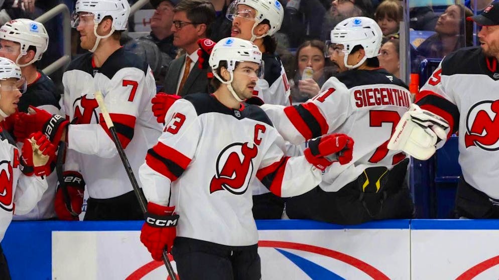 On a high: Captain Nico Hischier is congratulated by his teammates for scoring a goal for the fourth game in a row