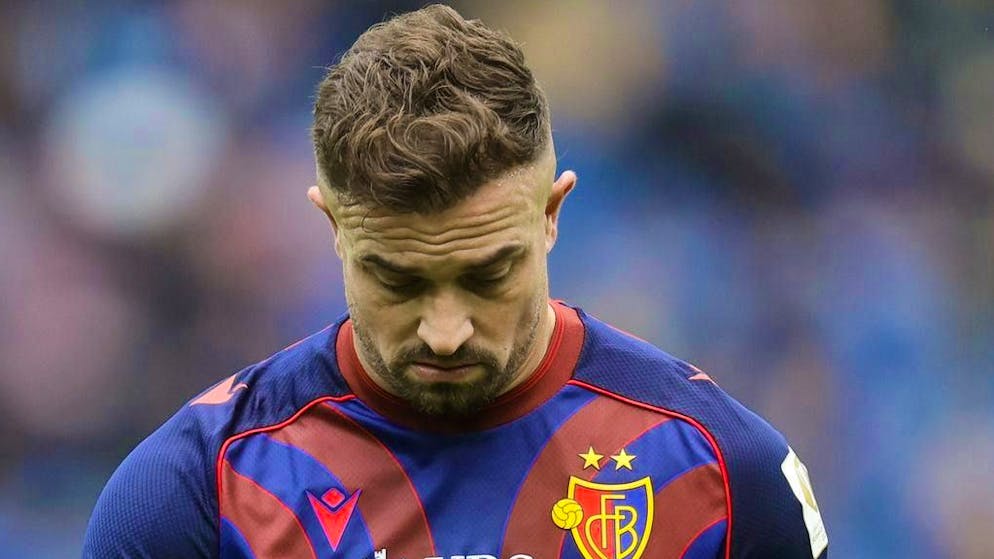 Xherdan Shaqiri leaves the pitch with his head hanging down.