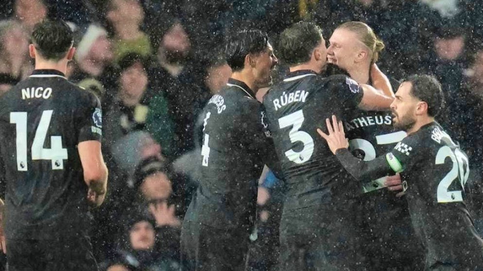 Erling Haaland receives congratulations from his team-mates after scoring his 100th Premier League goal for Manchester City.