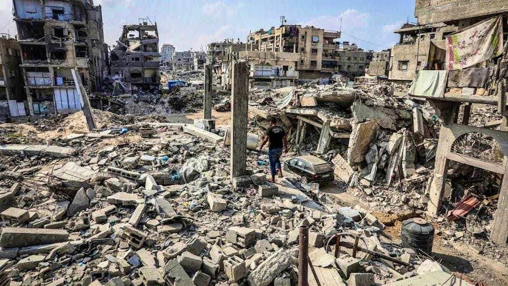 ARCHIVE - A Palestinian man walks through the ruins of destroyed buildings in the Al-Katiba neighborhood. Displaced Palestinians try to return to their homes after the Israeli army withdrew from the city. Photo: Abed Rahim Khatib/dpa