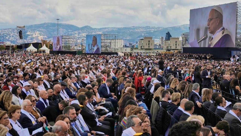 Believers attend a Holy Mass led by Pope Leo XIV at the port. Photo: Bilal Hussein/AP/dpa