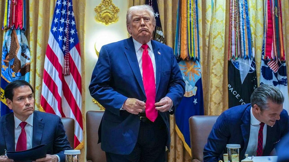 US President Donald Trump (center) at his cabinet meeting on Tuesday. Unlike other presidents, he wants the press present each time.