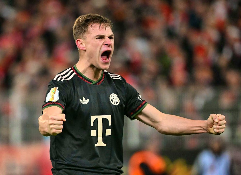 Bayern star Joshua Kimmich celebrates victory after the final whistle.