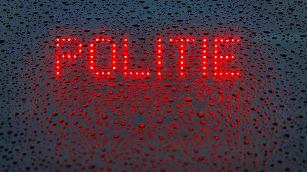 ARCHIVE - The Dutch word "Politie" ("Police") is displayed in the rear window of an emergency vehicle (symbolic image). Photo: Friso Gentsch/dpa