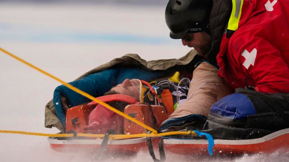 Alpine skiing. Aznoh suffers serious knee injury, but no head injury