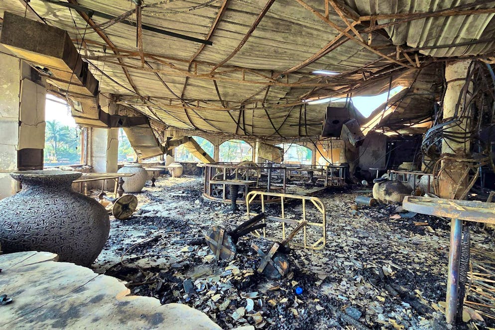 The charred interior of the nightclub that caught fire early Sunday in Arpora, Goa.
