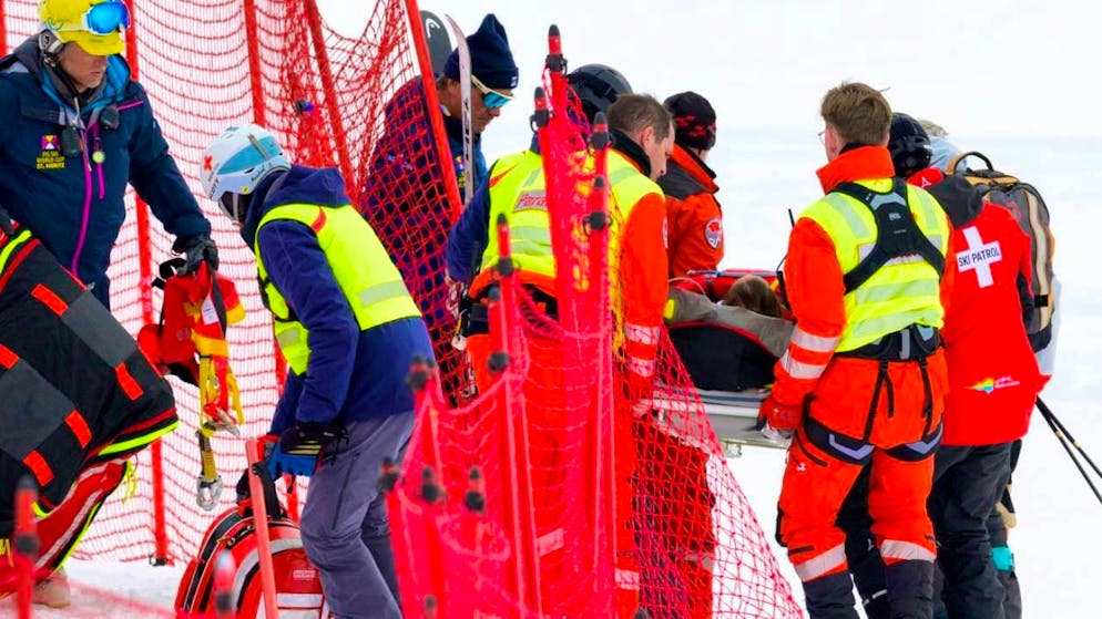 The medics and paramedics in action: Michelle Gisin is transported away after her serious fall