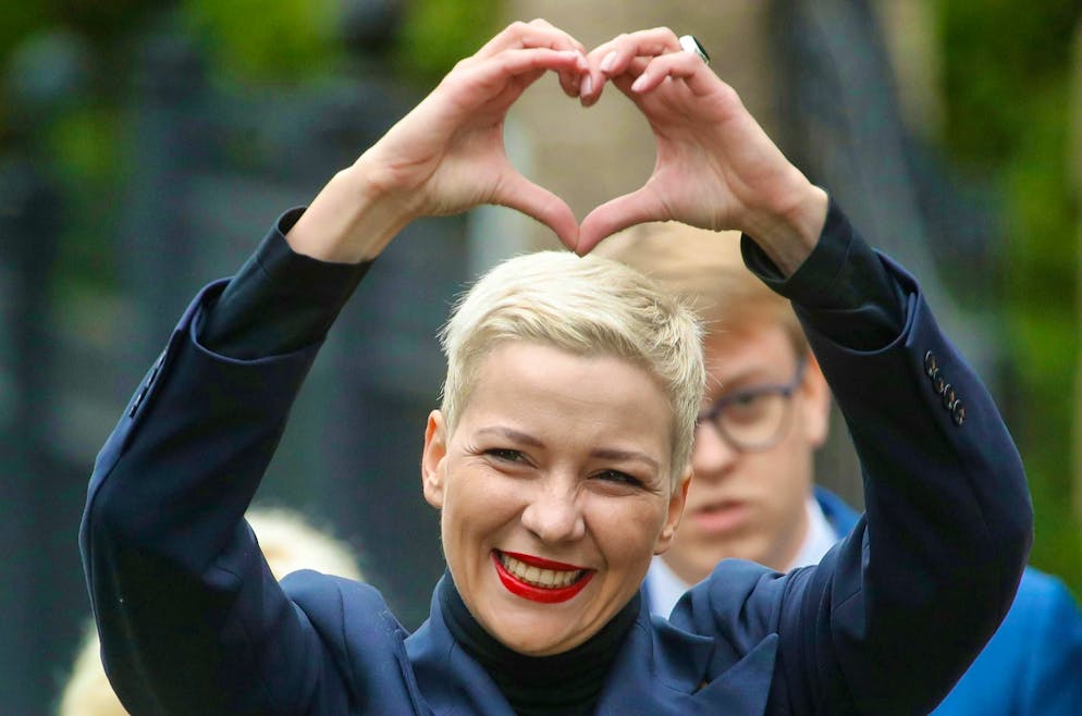 Maria Kolesnikova, one of the opposition leaders in Belarus, forms a heart with her hands on her way to an investigative committee.