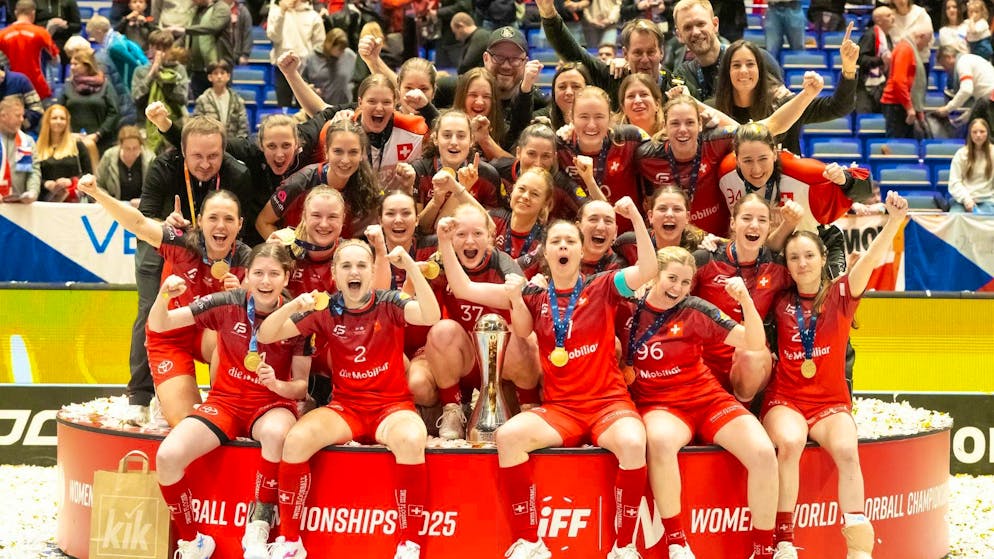 The Swiss women are celebrating the world championship title and the gold medal.