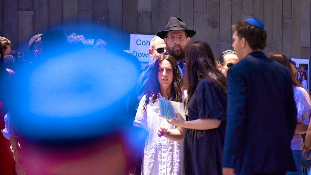 Mourners attend the funeral service for Rabbi Eli Schlanger in Sydney. (December 17, 2025)
