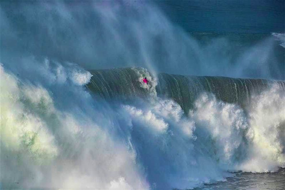 Surf pro Lucas Chianca disappears in a monster wave in Nazaré, Portugal.