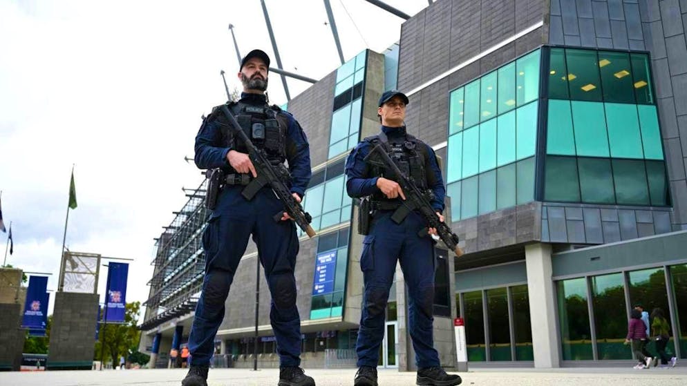 Victoria Police CIRT officers carry semi-automatic long guns during a Boxing Day security briefing at the MCG. Photo: James Ross/AAP/dpa