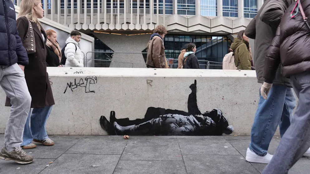 Child with a cap. New Banksy works cause a stir in London