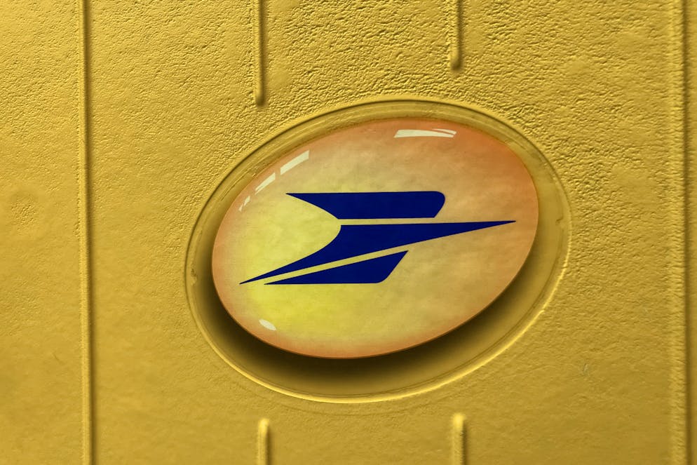 PARIS - APRIL 11, 2021: Embleme of La Poste postbox in Paris, France.