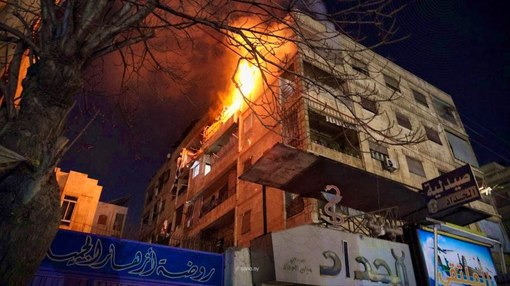 A picture from the Syrian news agency SANA shows a burning building in Aleppo. (December 22, 2025)