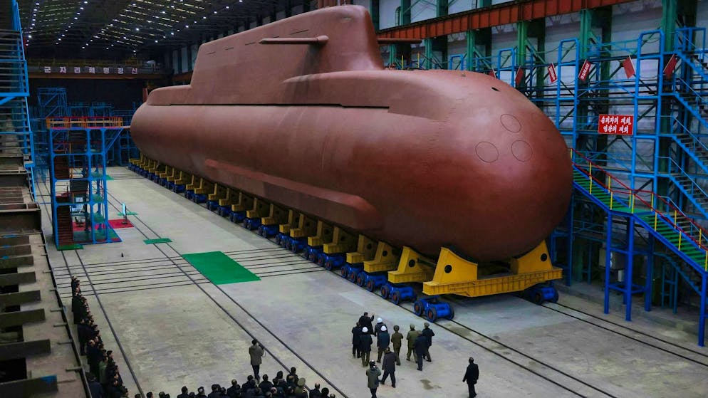 North Korea's ruler Kim Jong Un visits submarine shipyard.