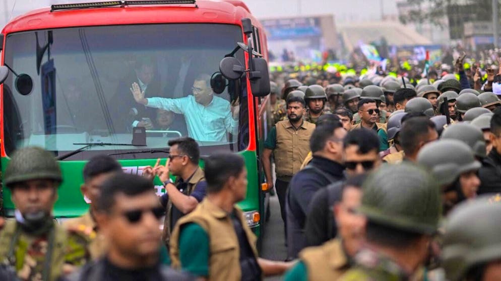 Tarique Rahman, executive chairman of the Bangladesh Nationalist Party (BNP), waves to his supporters from a bus in Dhaka after returning from London. Photo: Mahmud Hossain Opu/AP/dpa
