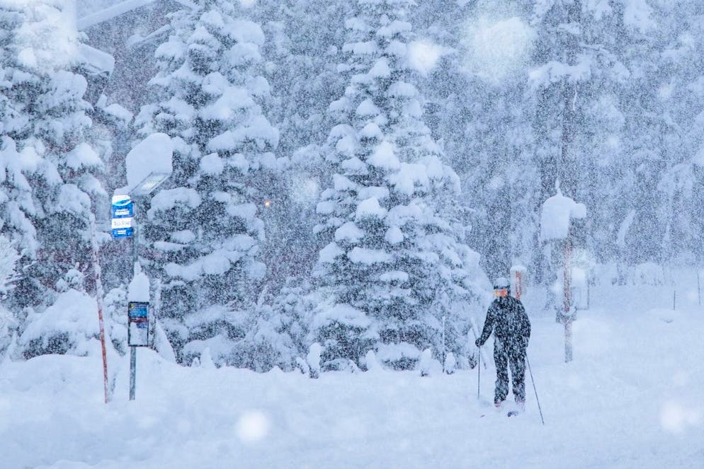 In this photo provided by the Mammoth Mountain Ski Area resort, snow comes down on a skier in Mammoth Lakes, Calif. on Wednesday, Dec. 24, 2025. (Samantha Lindberg/Mammoth Mountain Ski Area via AP)