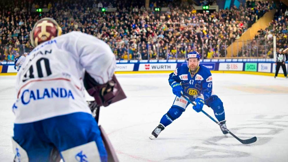 Gritted teeth: Leo Komarov is one of many Davos players to fail against College Selects goalie Adam Gajan