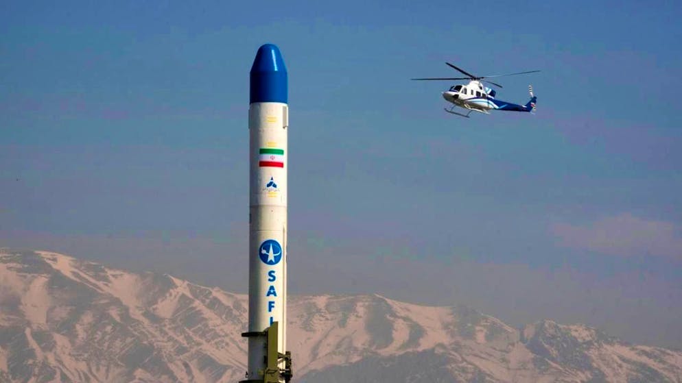 ARCHIVE - A helicopter flies over an Iranian satellite carrier. Photo: Vahid Salemi/AP/dpa