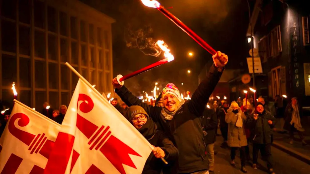 Projurassiers celebrate the transfer of the previously Bernese town to the canton of Jura with a torchlight procession on New Year's Eve.