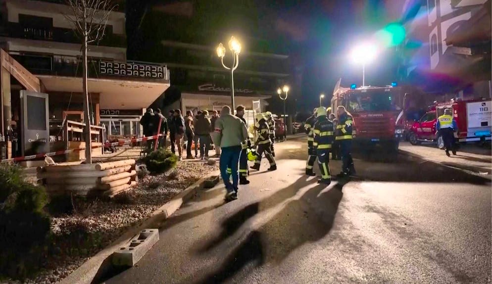Rescue workers outside Le Constellation bar early Thursday morning.