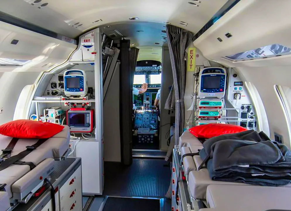 View inside the ambulance jet, where there are height-adjustable stretchers and lots of equipment.