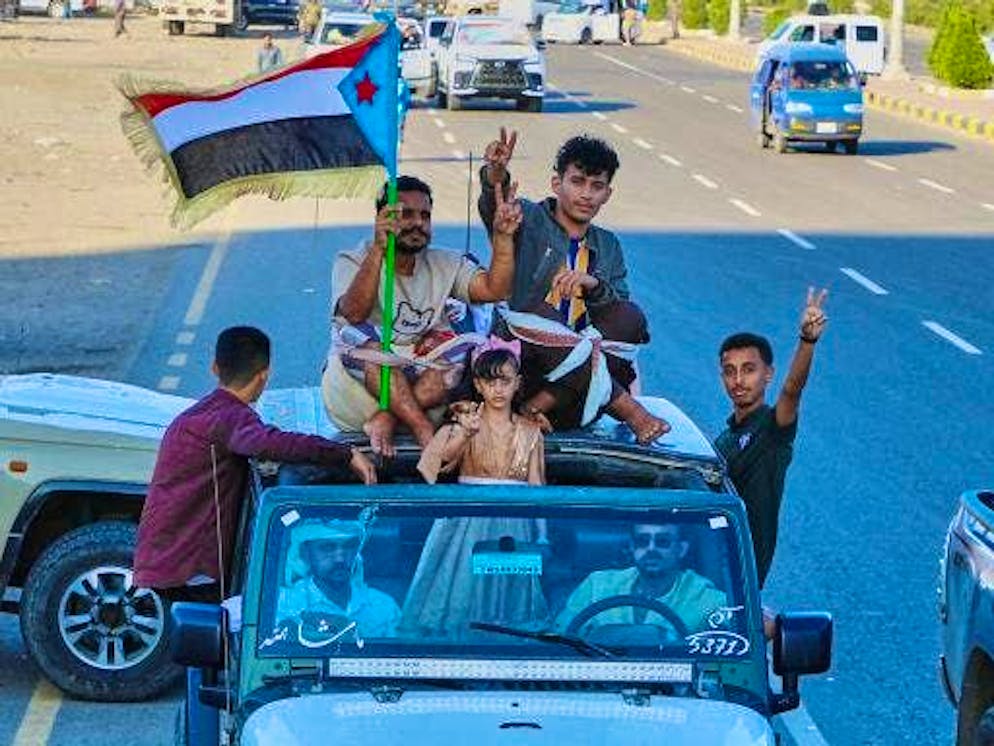 Supporters of the so-called Southern Transitional Council (STC), a coalition of separatist groups who want to restore the state of South Yemen, hold a South Yemeni flag during a rally.