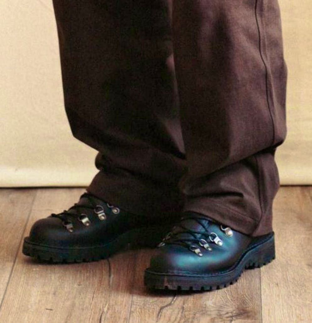 Robust lace-up boots with a distinctive tread sole combine functionality with style.