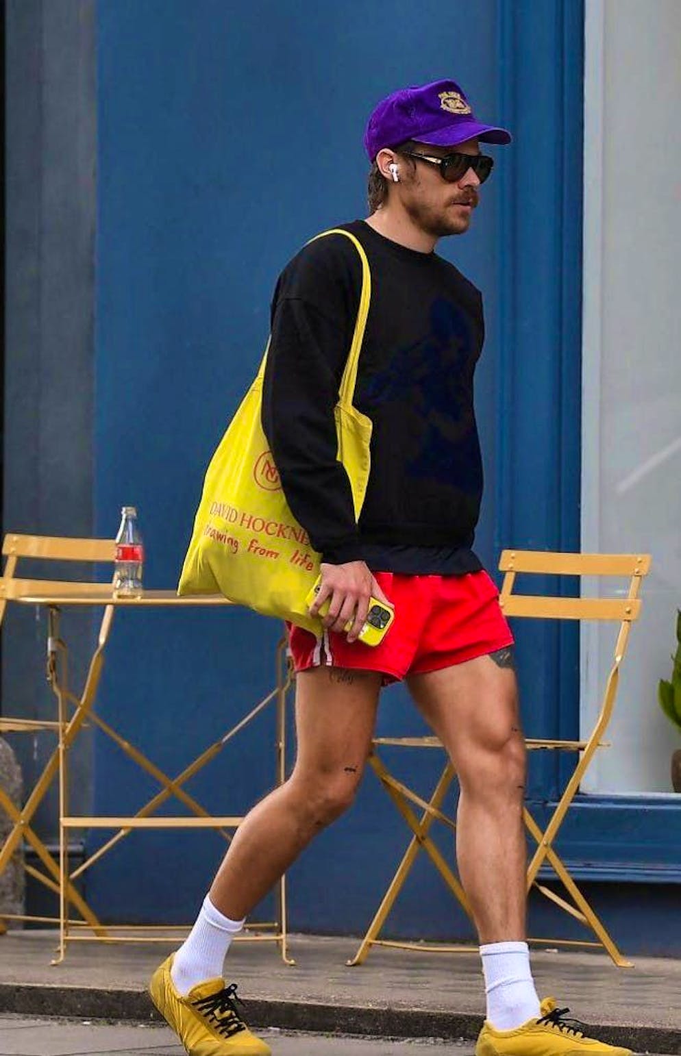 Singer Harry Styles in fashionable shorts.