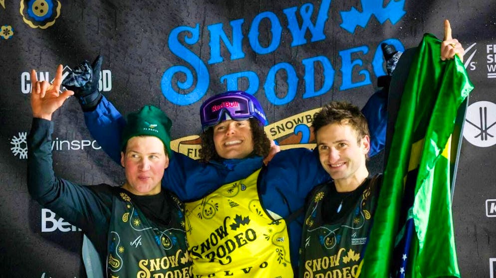 Strong second place: Swiss snowboarder David Hablützel (left) celebrates in Calgary alongside winner Valentino Guseli