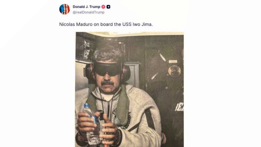 This image shows a TruthSocial post by US President Donald Trump that purports to show a photo of captured Venezuelan President Nicolás Maduro on board the warship "USS Iwo Jima" on January 3, 2026. On the Truth Social platform, Trump posted a picture on January 3, 2026 showing Maduro tied up, standing in a jogging suit and wearing headphones. Photo: Uncredited/TruthSocial/AP/dpa - ATTENTION: For editorial use only in connection with current reporting and only with full attribution of the above credit