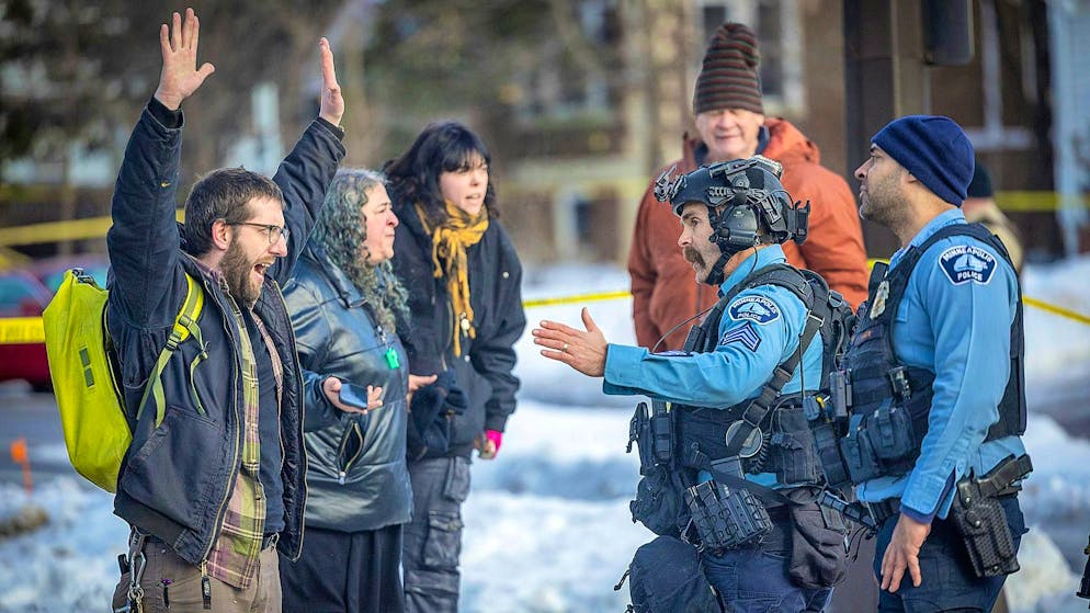 Protesters gather at the scene of the incident and confront security officers.