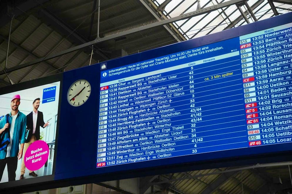 The board at the main station indicates the minute's silence.