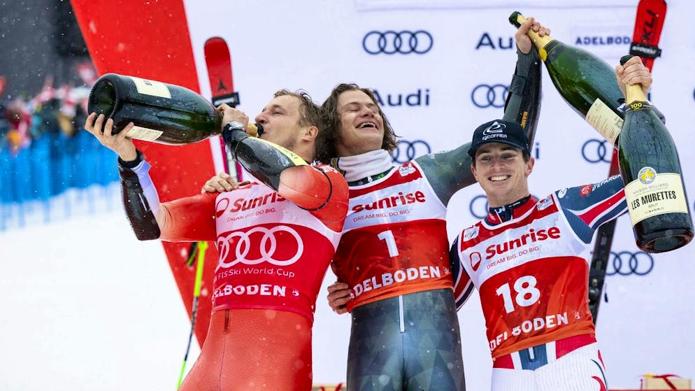 Lucas Pinheiro Braathen (center) celebrates with relief with Marco Odermatt and Léo Anguenot.