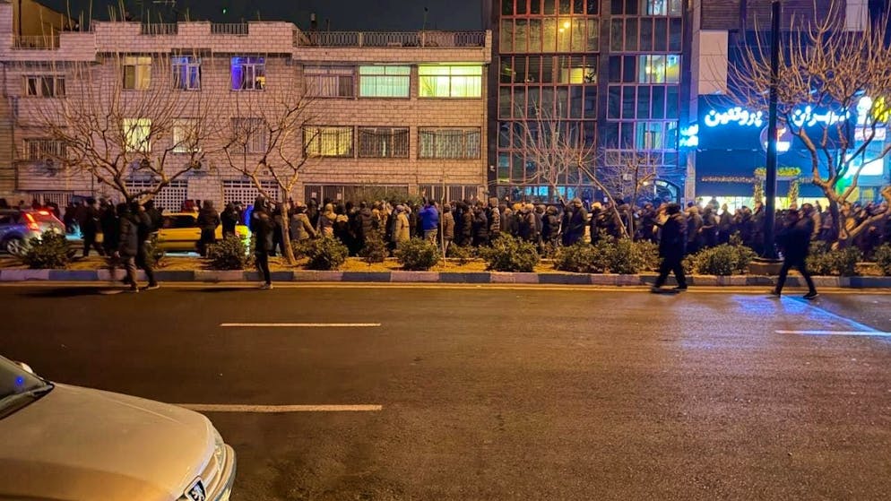 This photo taken on January 8 and made available via AP on January 13 purports to show Iranians protesting against the government in Tehran. Iranians have been demonstrating against their country's authoritarian leadership for more than two weeks. Human rights organizations have documented hundreds of deaths. Photo: Uncredited/UGC/AP/dpa - ATTENTION: For editorial use only in connection with current reporting and only with full attribution of the above credit