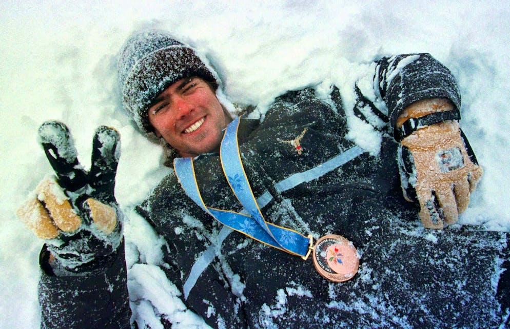 Swiss snowboarder Ueli Kestenholz rolls through the snow in Nagano in 1998, adorned with the Olympic bronze medal.