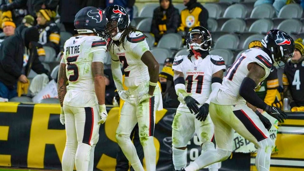 The Houston Texans celebrate the first away playoff win in their history