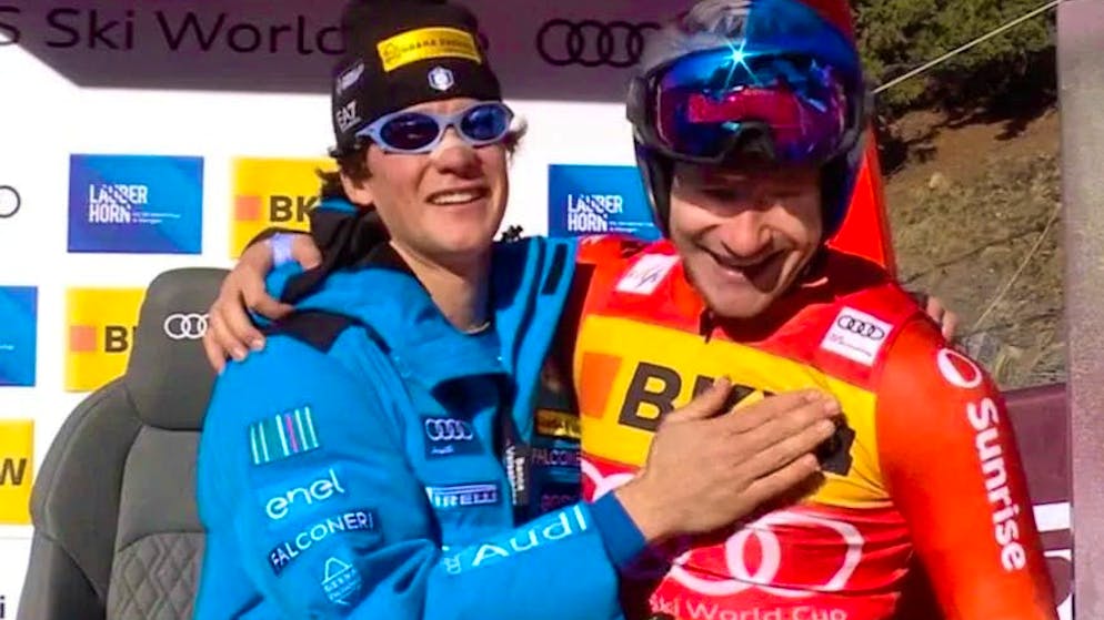 Marco Odermatt congratulates Franzoni in the leader's box on his dream run.