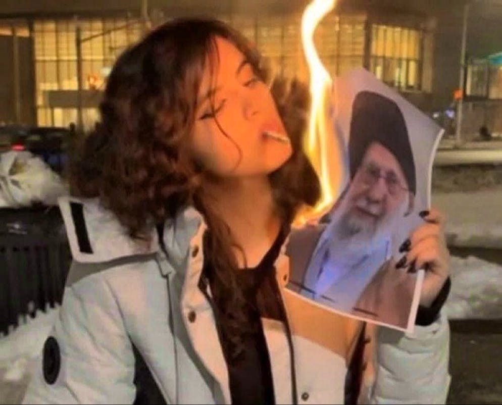 This woman went viral because she set fire to a photo of Iran's Supreme Leader, Ayatollah Ali Khamenei, in a video.