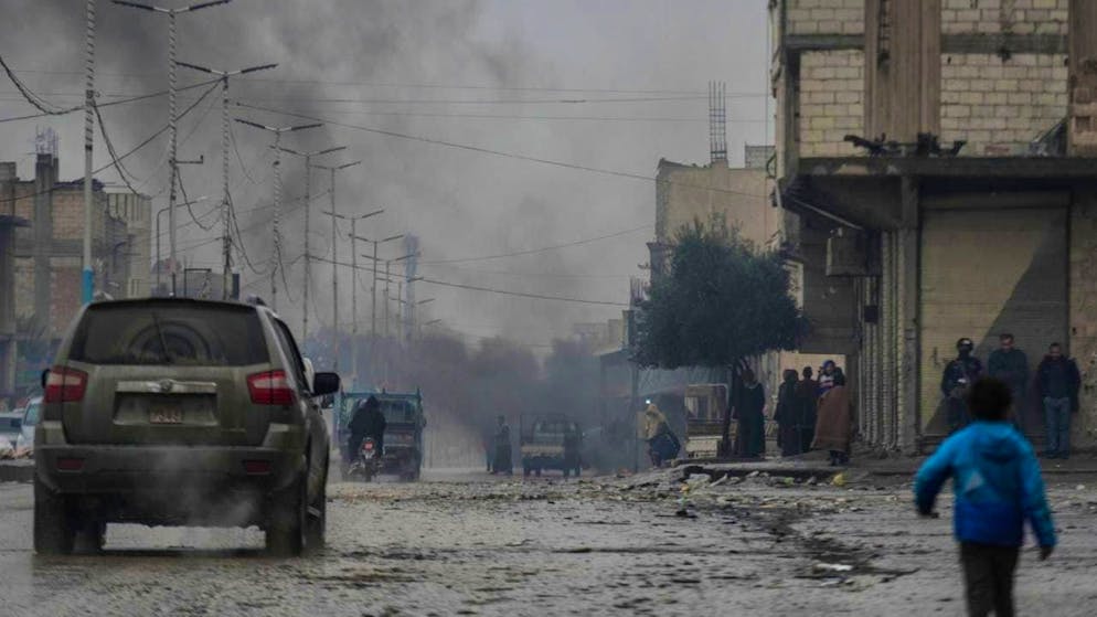 A boy walks through a street after it was captured by the Syrian army. Photo: Moawia Atrash/dpa