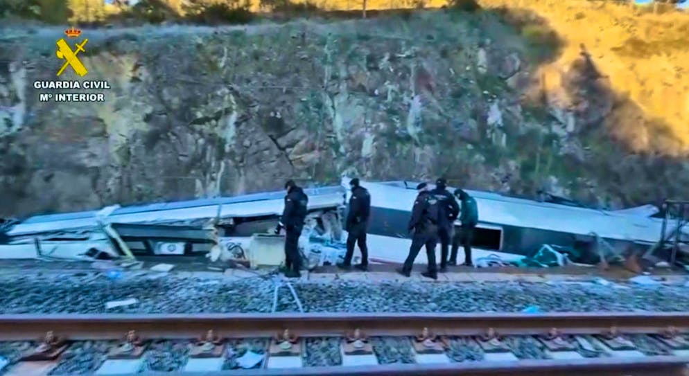 Train crash in Spain - details of victims expected - Gallery. Two carriages fell down a four-meter-high embankment.