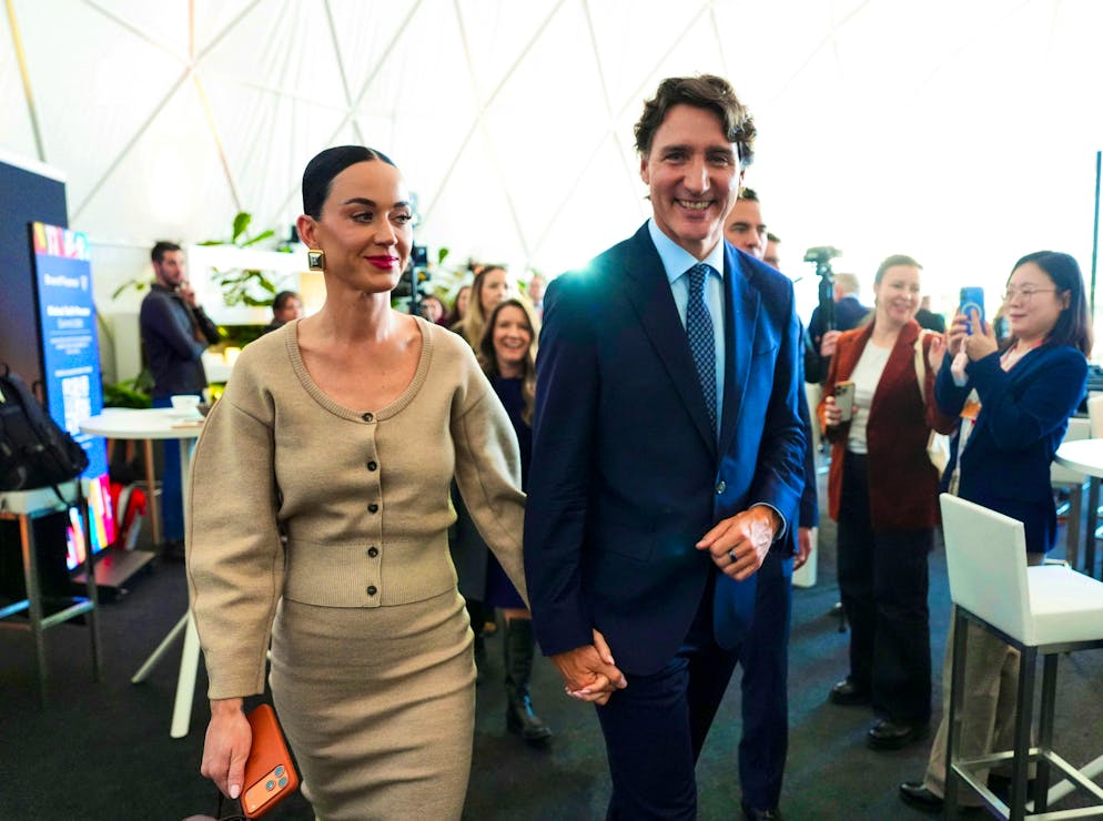 Canada's ex-Prime Minister Justin Trudeau appears holding hands with pop star Katy Perry at the WEF 2026 in Davos on Tuesday.