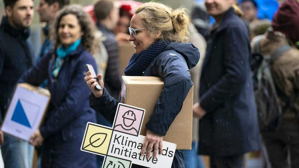 National Councillor Aline Trede, GP-BE, and others from Green Switzerland and SP Switzerland submit the climate fund initiative with 100,000 signatures in Bern on February 22, 2024.