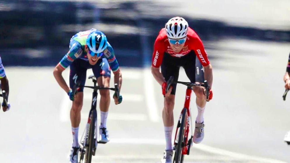 Swiss road champion Mauro Schmid (right) sprints to the podium in the 2nd stage of the Tour Down Under