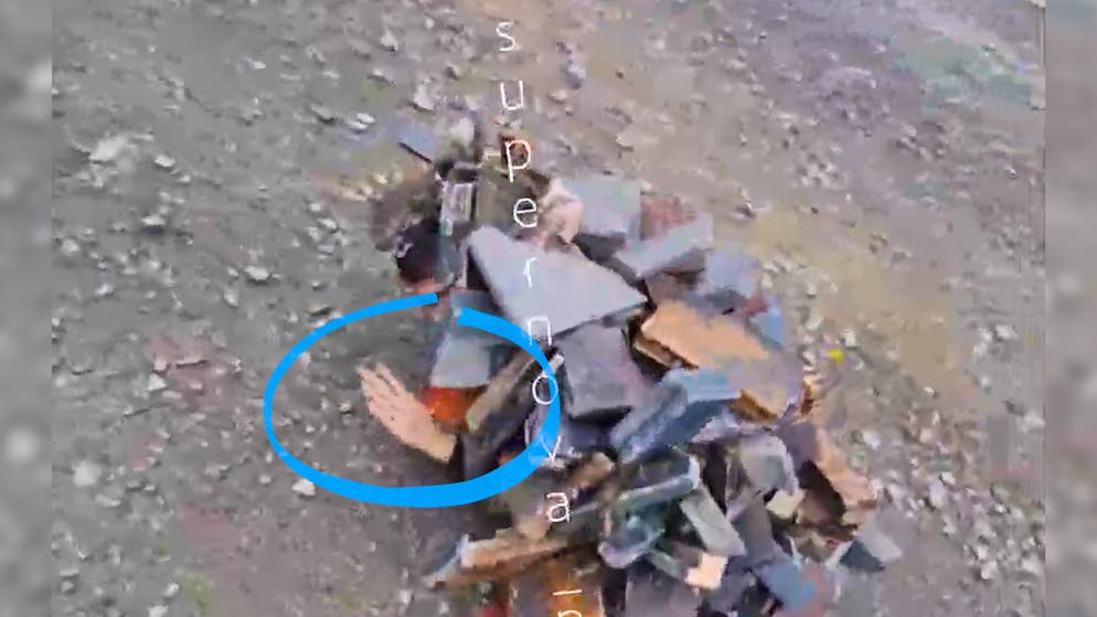 A bizarre method of survival. Russian soldiers disguise themselves as piles of garbage